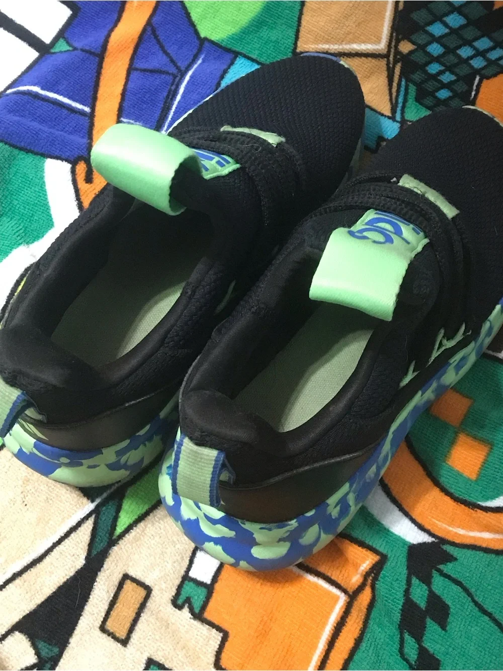 Adidas Kids Black Sneakers with Neon Green and Blue Patterned Sole